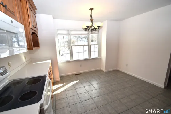 a view of a kitchen with a sink and a stove top oven