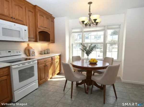 a kitchen with a stove a sink and a microwave