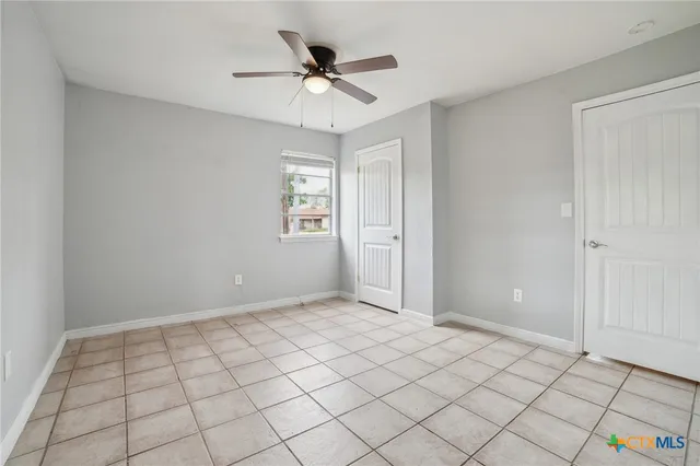 a view of an empty room and window