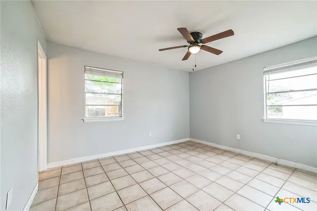 a view of an empty room and window