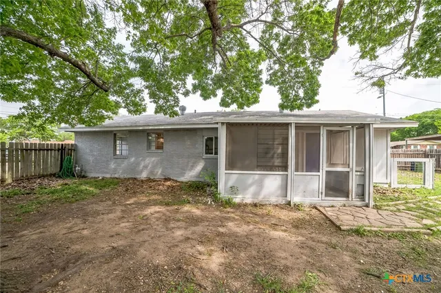 a house with trees in the background