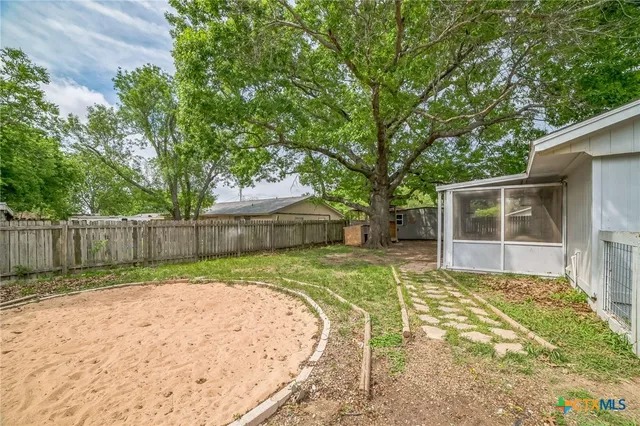 a view of a backyard with a small cabin