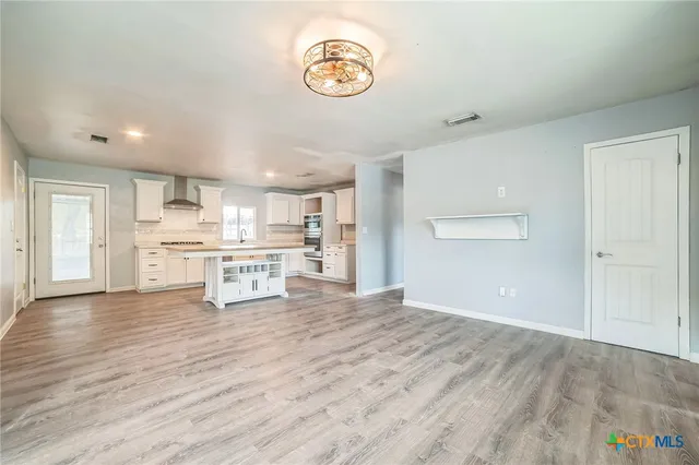 a view of kitchen with wooden floor