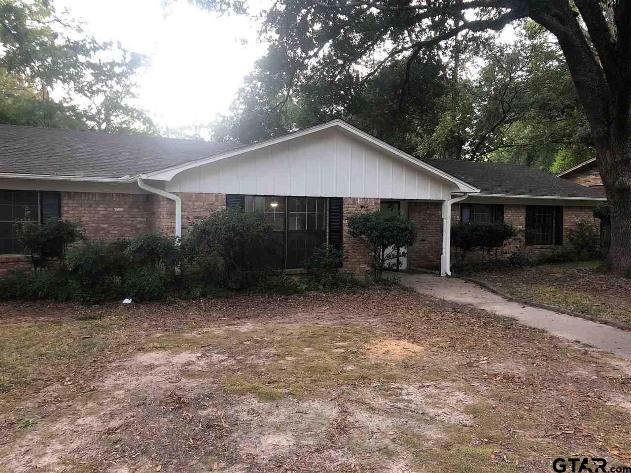 3001 South Robertson Avenue Tyler, TX 75701 - Photo 1 of 12 a view of a house with backyard and garden