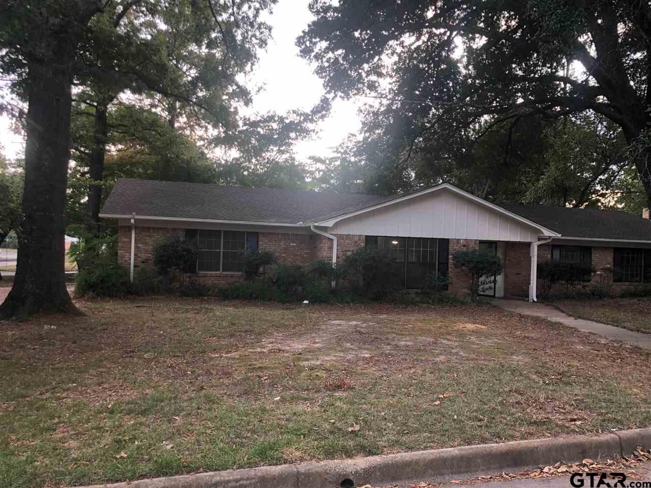 3001 South Robertson Avenue Tyler, TX 75701 - Photo 2 of 12 a front view of a house with a yard