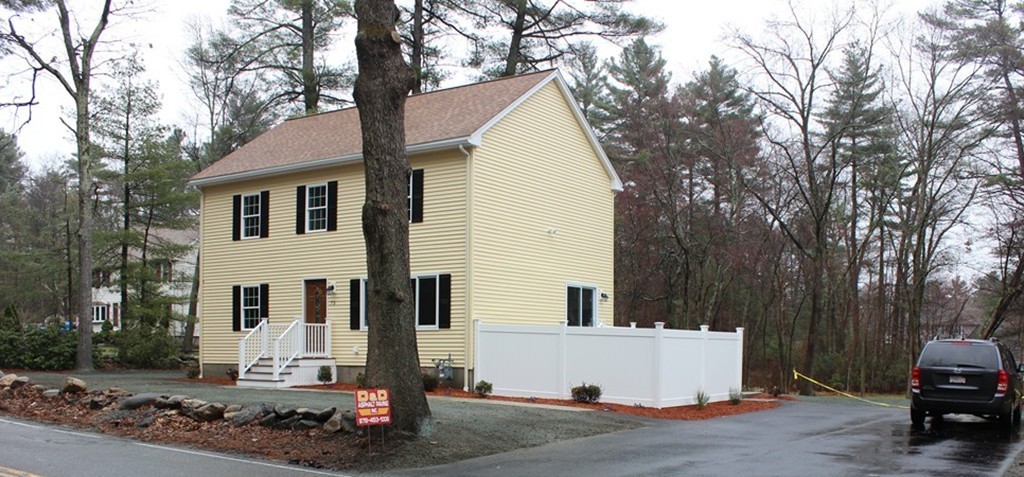 75 Baldwin Road Billerica, MA 01821 - Photo 2 of 30 a view of a white house with a large tree