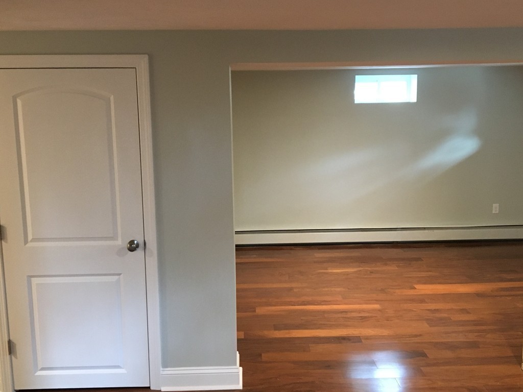 75 Baldwin Road Billerica, MA 01821 - Photo 21 of 30 a view of a room with wooden floor