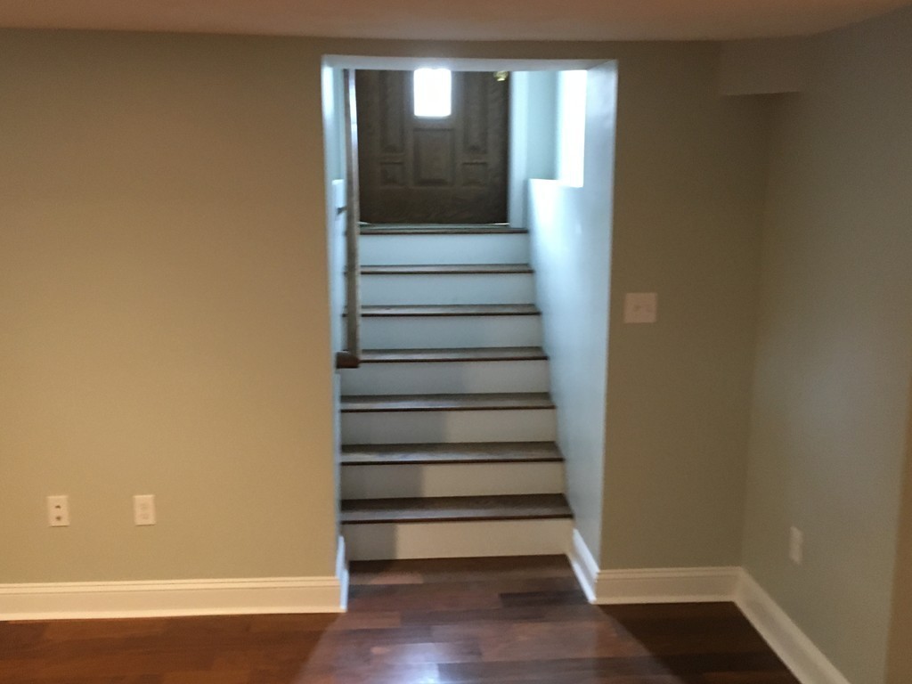 75 Baldwin Road Billerica, MA 01821 - Photo 23 of 30 a view of entryway and hall with wooden floor