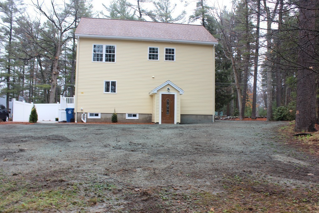 75 Baldwin Road Billerica, MA 01821 - Photo 5 of 30 a view of a house with a yard