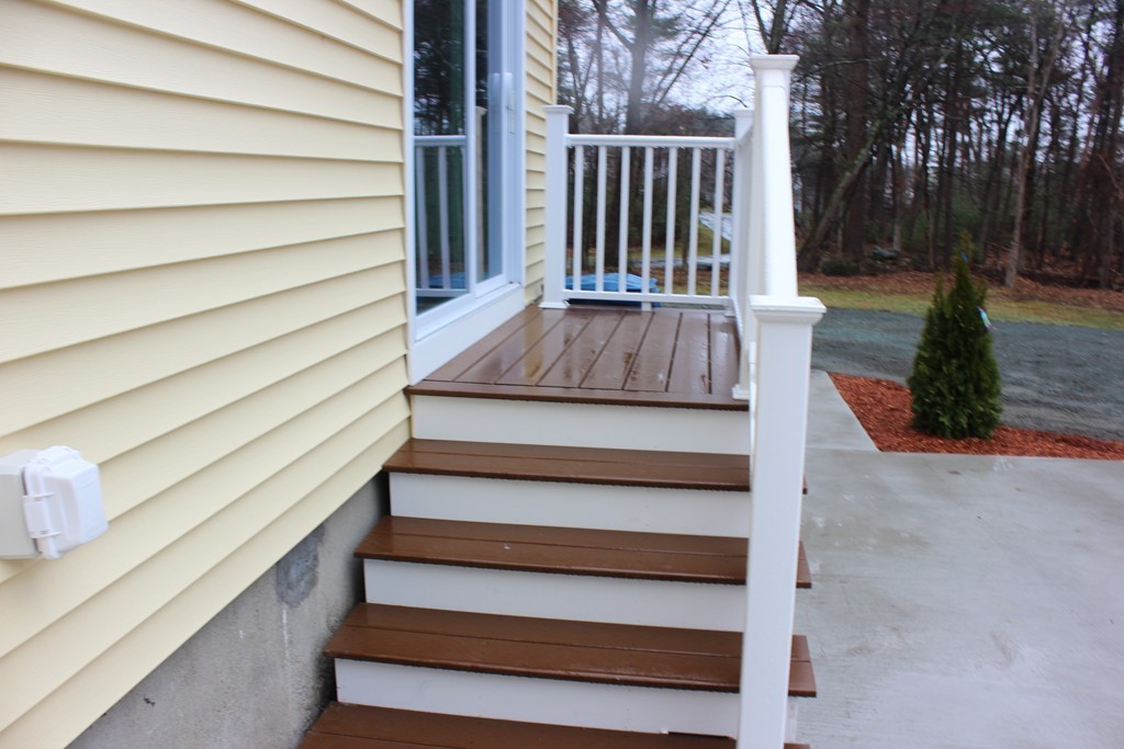 75 Baldwin Road Billerica, MA 01821 - Photo 8 of 30 a view of entryway with wooden floor and a fire pit