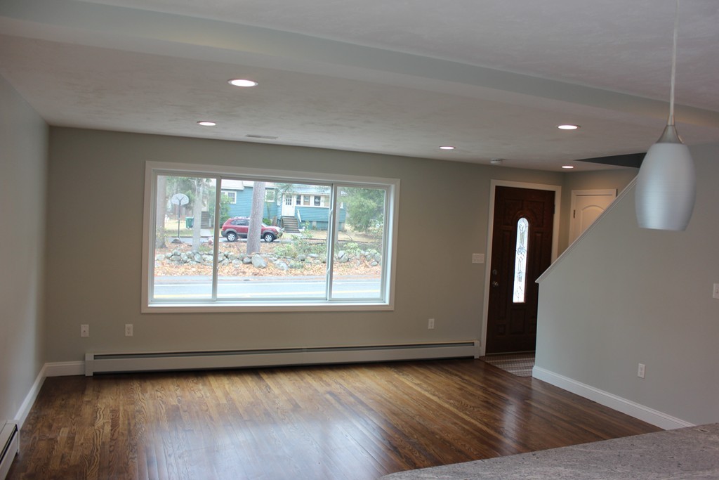 75 Baldwin Road Billerica, MA 01821 - Photo 10 of 30 an empty room with wooden floor and window