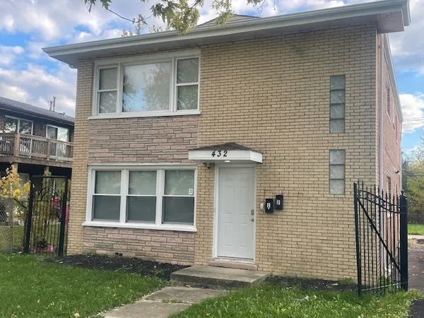 a brick house with a large windows