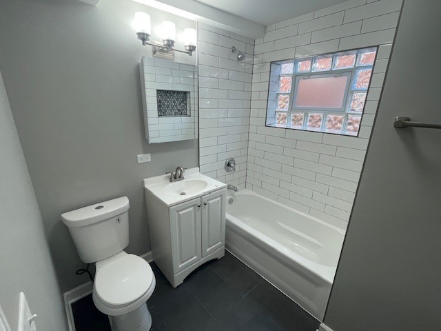 432 West Hickory Street, Unit 2 Chicago Heights, IL 60411 - Photo 10 of 10 a bathroom with a sink toilet and shower