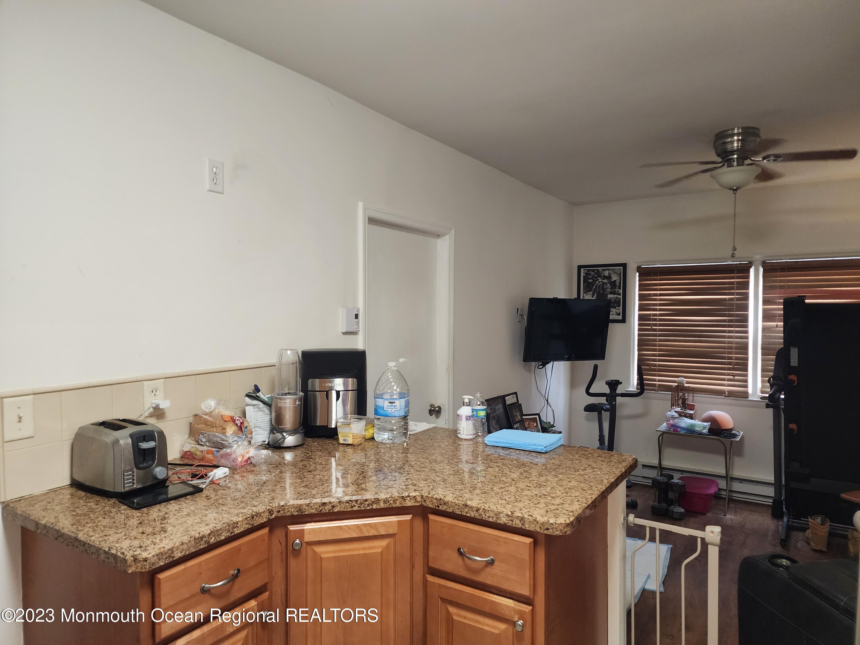35 Hartford Road Whiting, NJ 08759 - Photo 31 of 47 a kitchen with stainless steel appliances granite countertop a sink and a stove