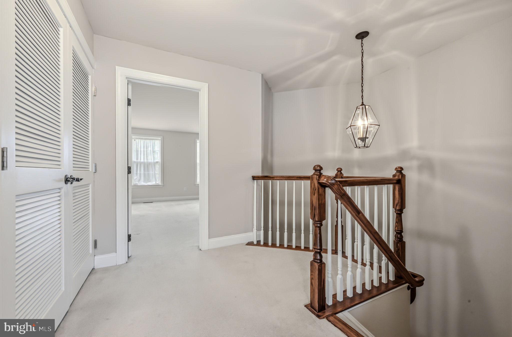 208 Jackdaw Alley, Unit 208 Springfield, PA 19064 - Photo 33 of 49 a view of a hallway with windows