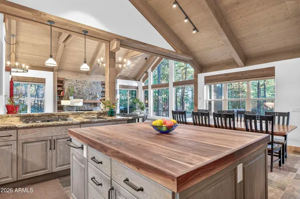 a view of a kitchen with a sink and wooden floor
