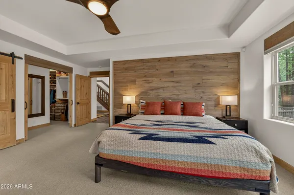 a bedroom with bed and window