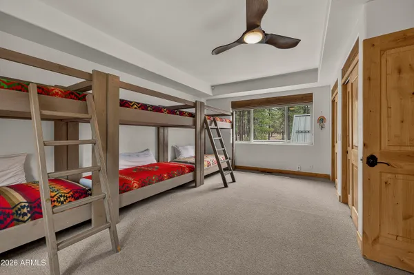 a room with furniture and a ceiling fan
