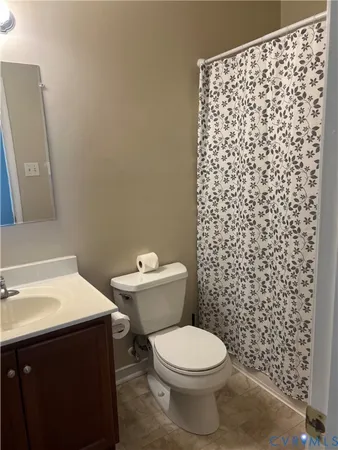 a bathroom with a toilet and a sink