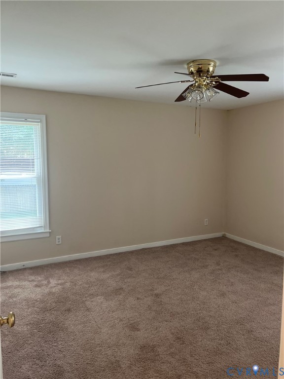9055 Castle Point Road Glen Allen, VA 23060 - Photo 9 of 19 an empty room with a window and a fan