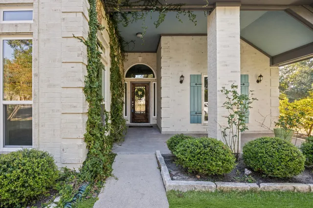 front view of a house with a garden