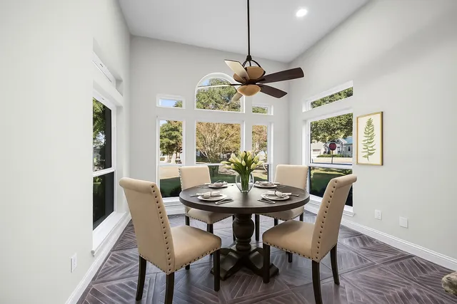 a view of a dining room with furniture window and wooden floor
