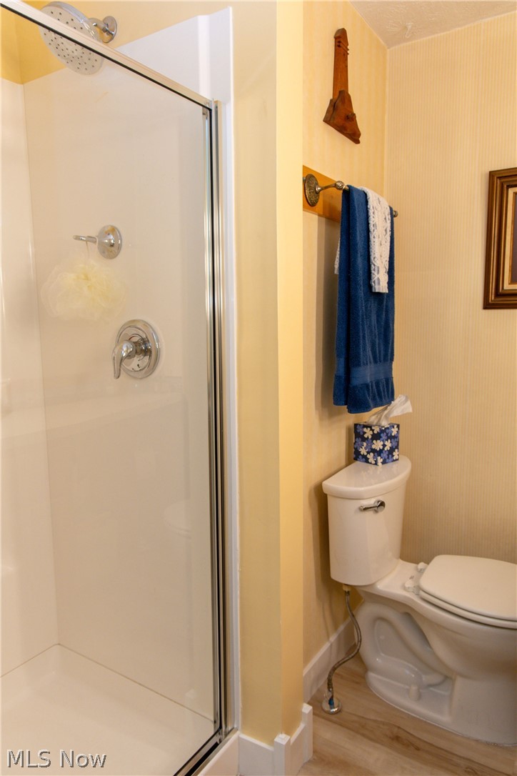 5467 Chapel Road Madison, OH 44057 - Photo 37 of 50 Bathroom featuring a stand-up shower with a glass enclosure, chrome fixtures, and a white shower pan