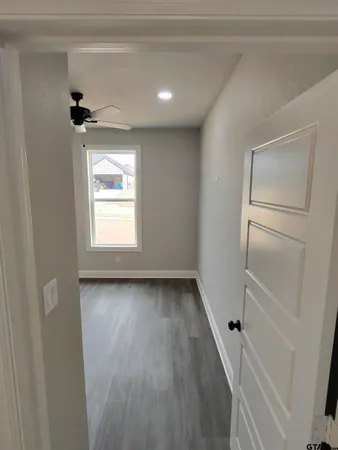 a view of a hallway with a window