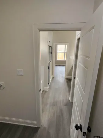 a white bath tub sitting next to a window