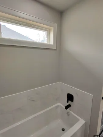 a view of a room with a large window