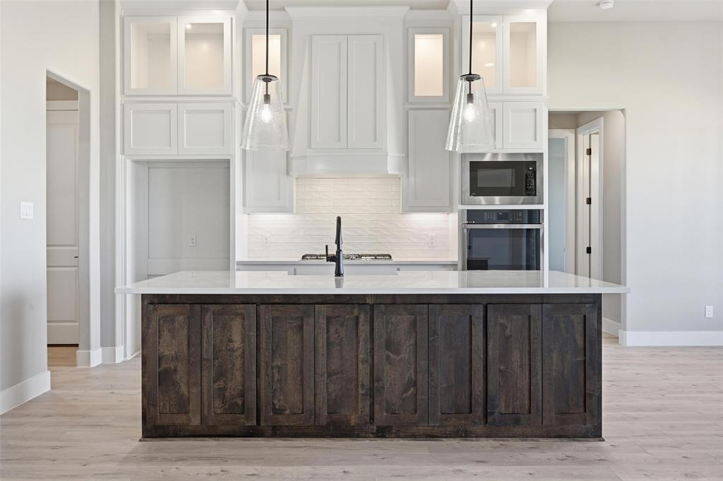 108 Rocky Top Azle, TX 76020 - Photo 3 of 40 a kitchen with stainless steel appliances a sink and cabinets