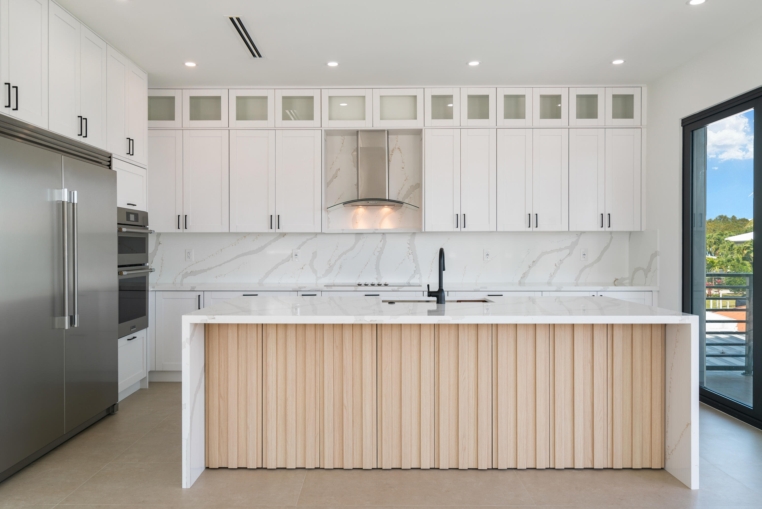 27 Ocean Drive Key Largo, FL 33037 - Photo 1 of 61 a kitchen with stainless steel appliances granite countertop a refrigerator and a sink