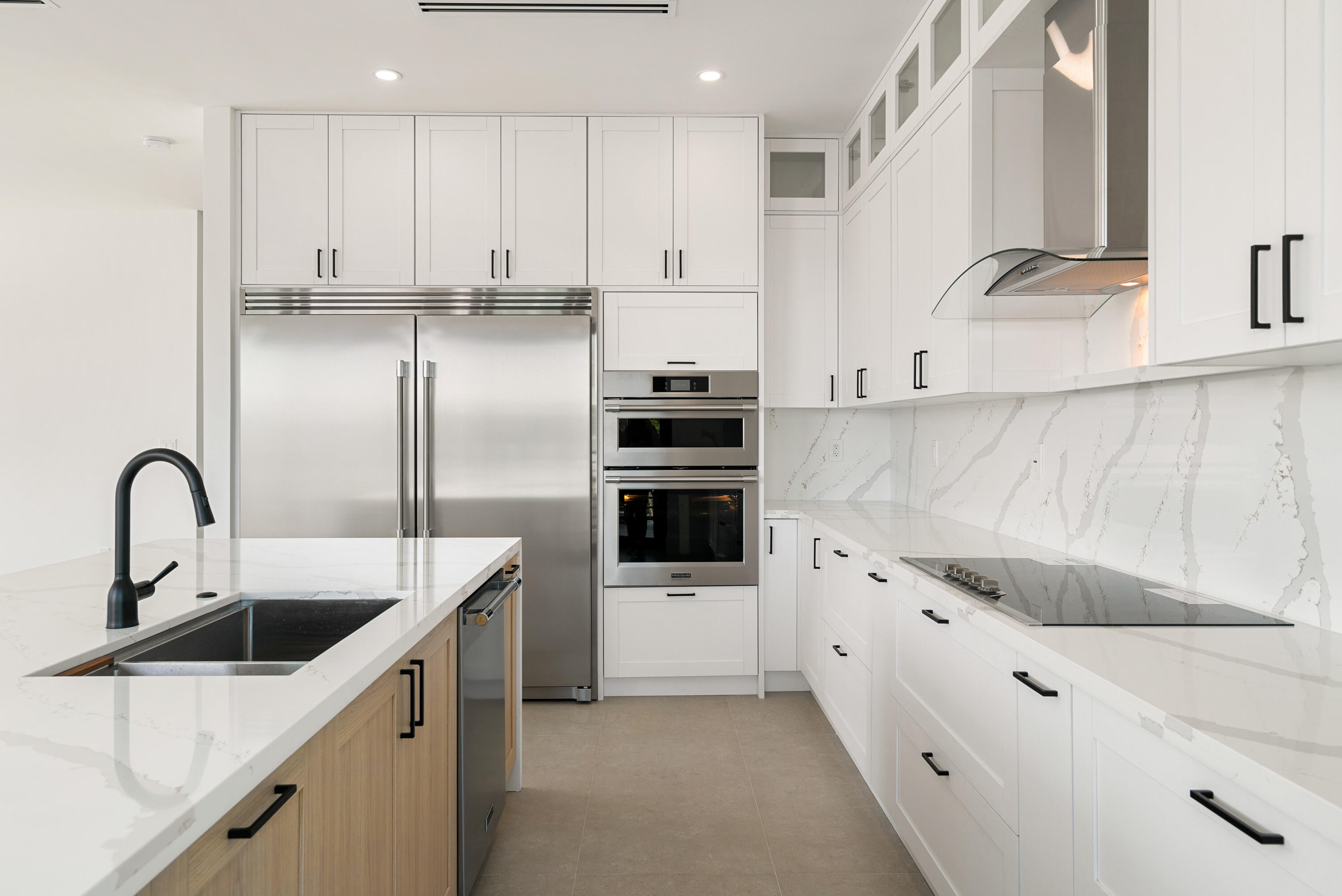 27 Ocean Drive Key Largo, FL 33037 - Photo 12 of 61 a kitchen with stainless steel appliances kitchen island a white counter top space and cabinets