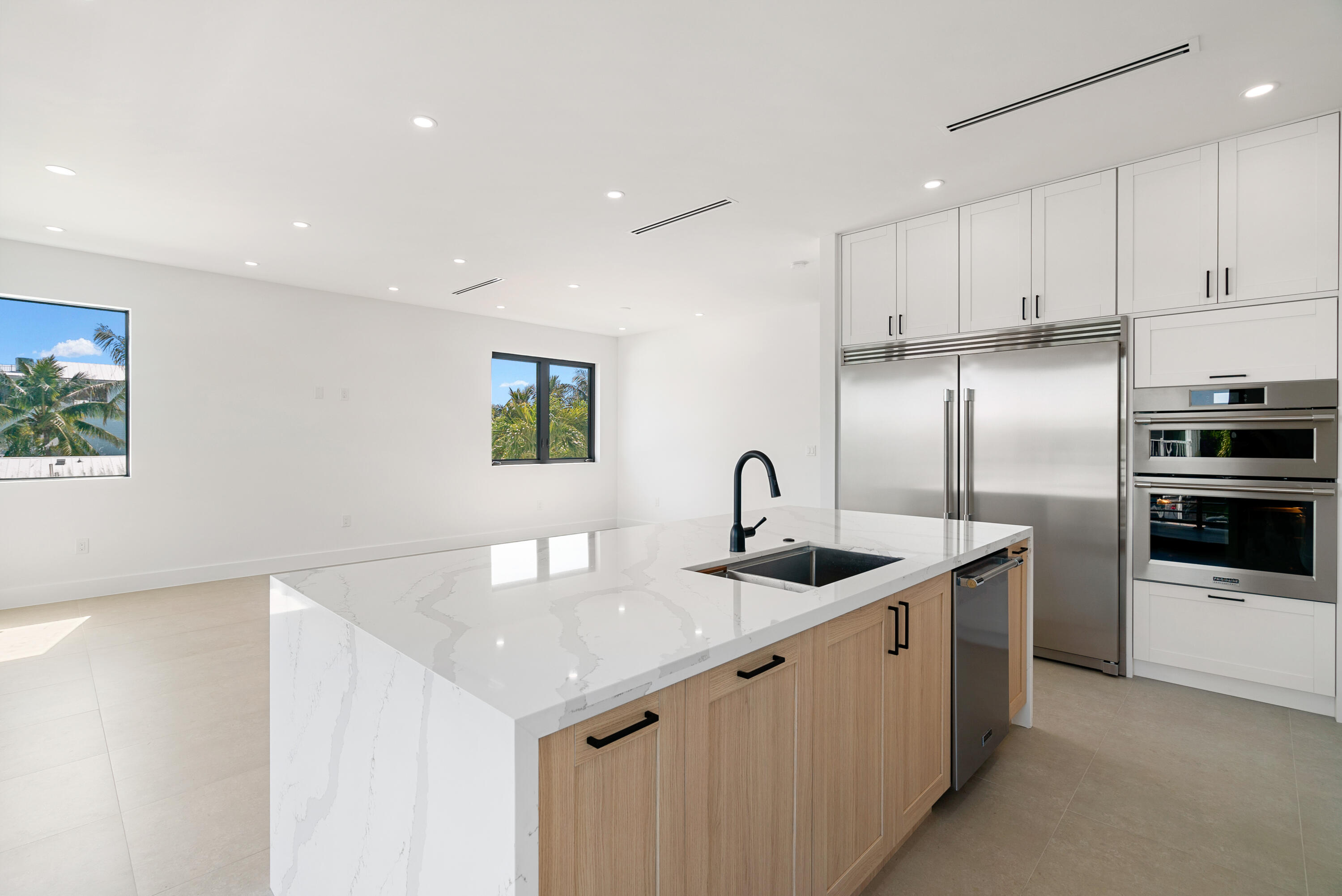27 Ocean Drive Key Largo, FL 33037 - Photo 13 of 61 a kitchen with stainless steel appliances granite countertop a sink and refrigerator