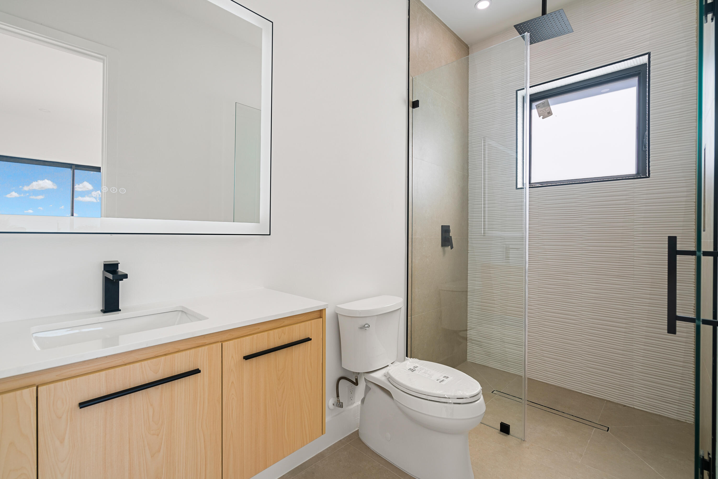 27 Ocean Drive Key Largo, FL 33037 - Photo 19 of 61 a bathroom with a sink a toilet and shower