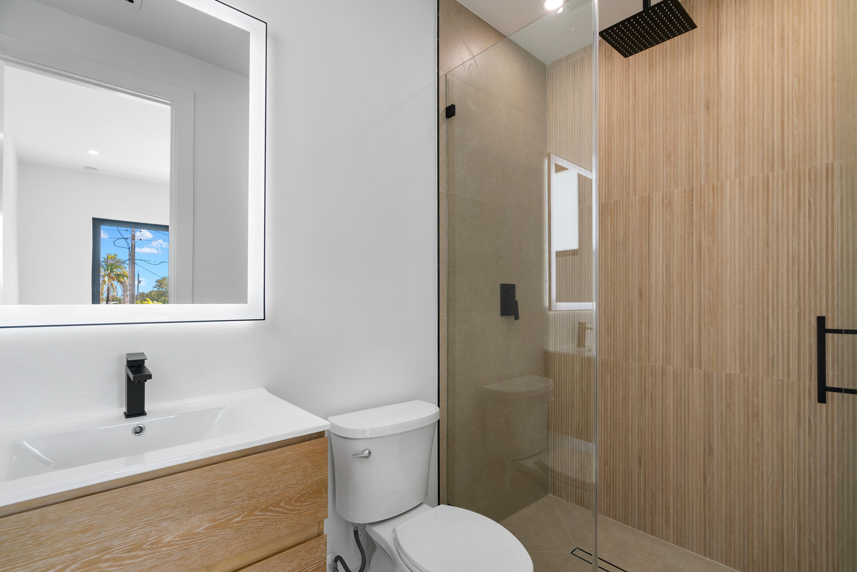 27 Ocean Drive Key Largo, FL 33037 - Photo 22 of 61 a white toilet sitting next to a bathroom sink