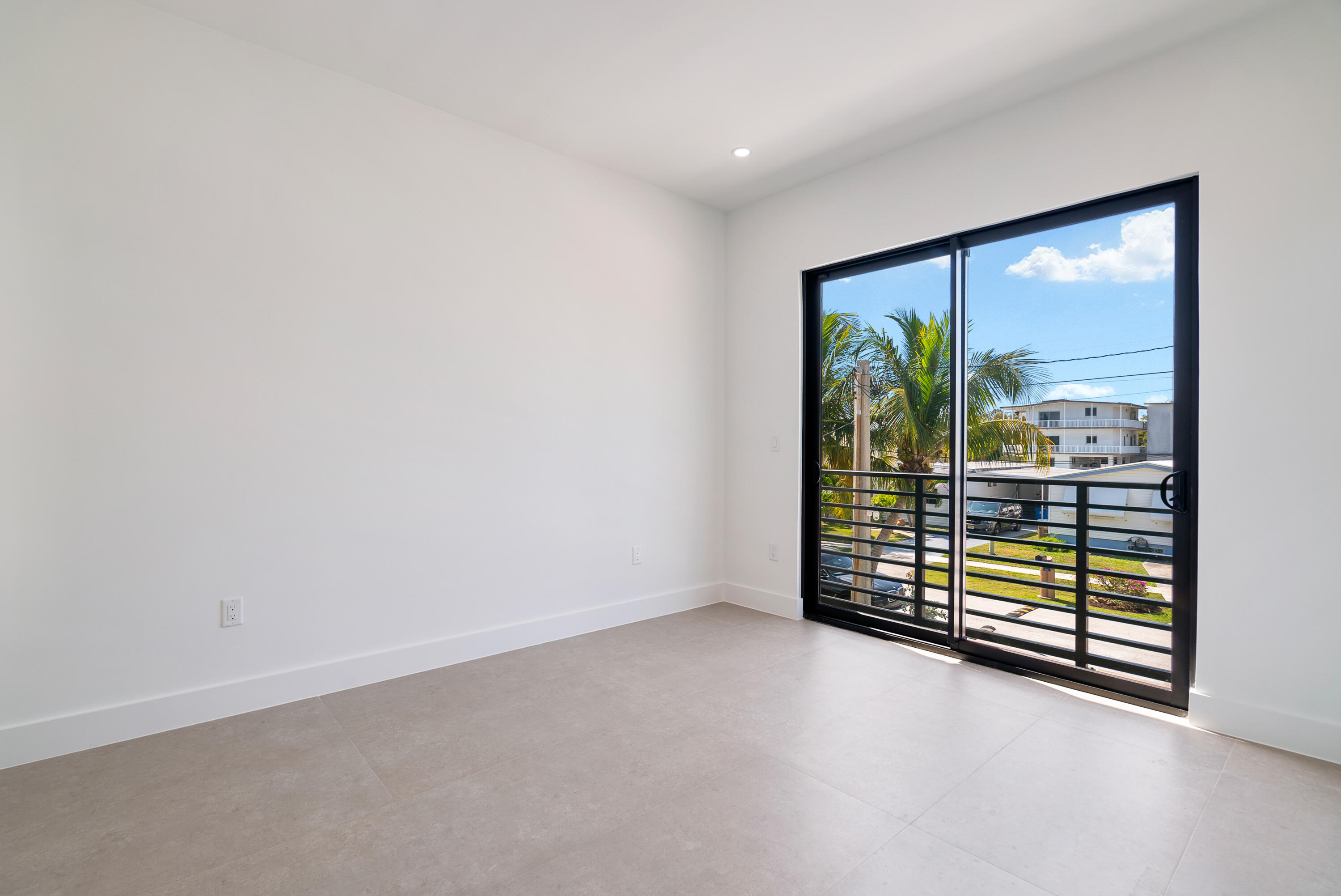 27 Ocean Drive Key Largo, FL 33037 - Photo 27 of 61 an empty room with floor to ceiling window and an outdoor view