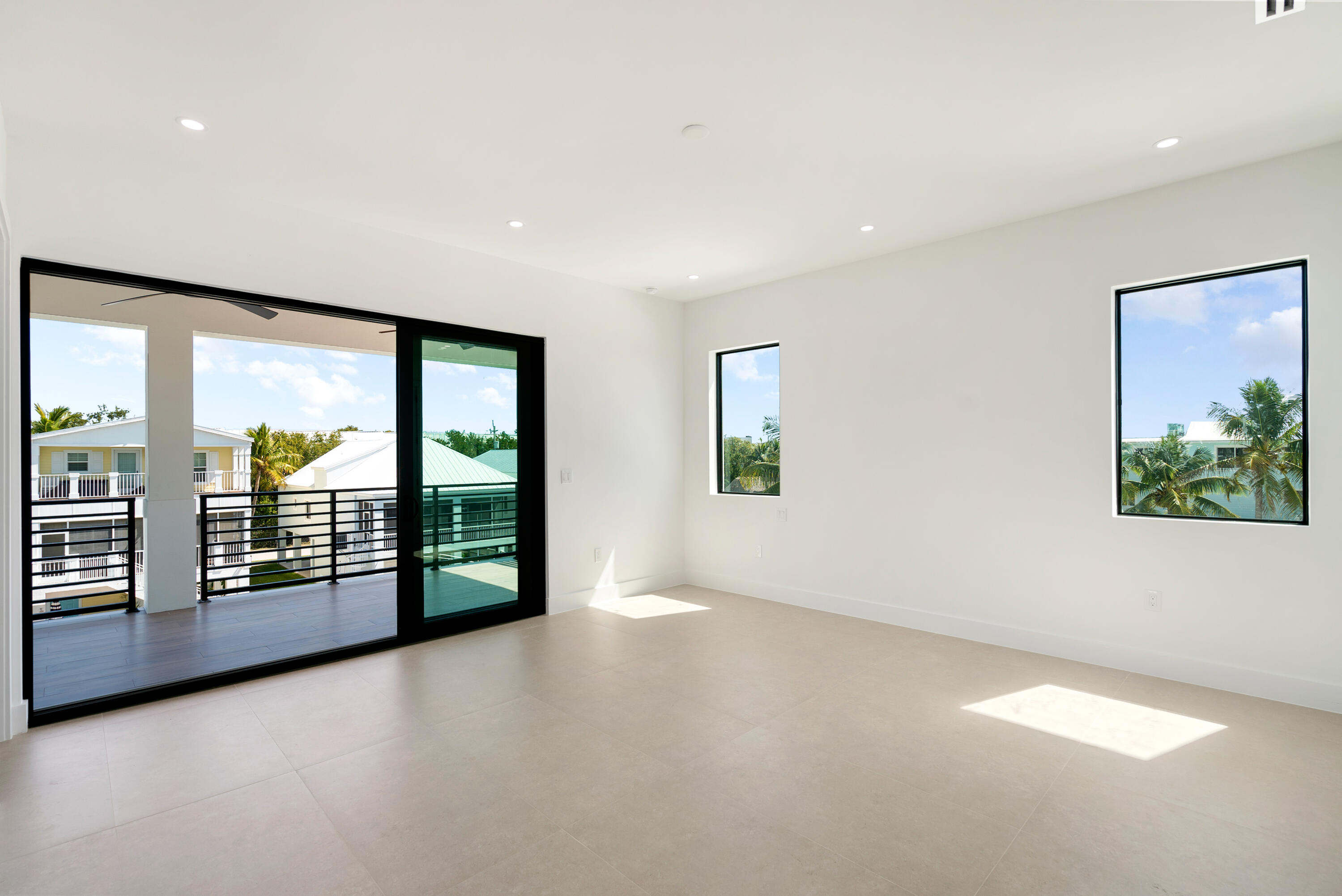 27 Ocean Drive Key Largo, FL 33037 - Photo 29 of 61 wooden floor in an empty room with a window