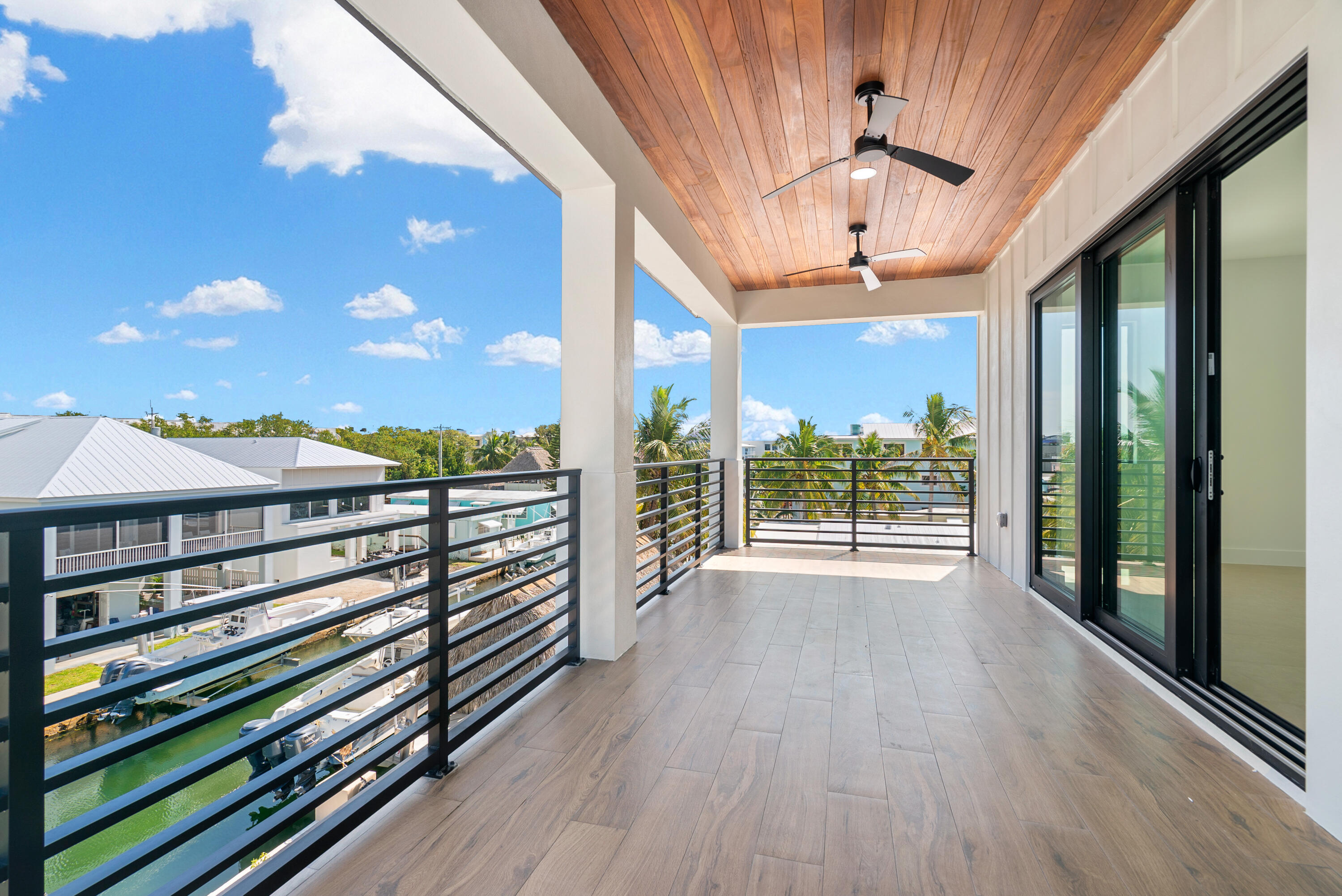 27 Ocean Drive Key Largo, FL 33037 - Photo 37 of 61 a view of a balcony with wooden floor