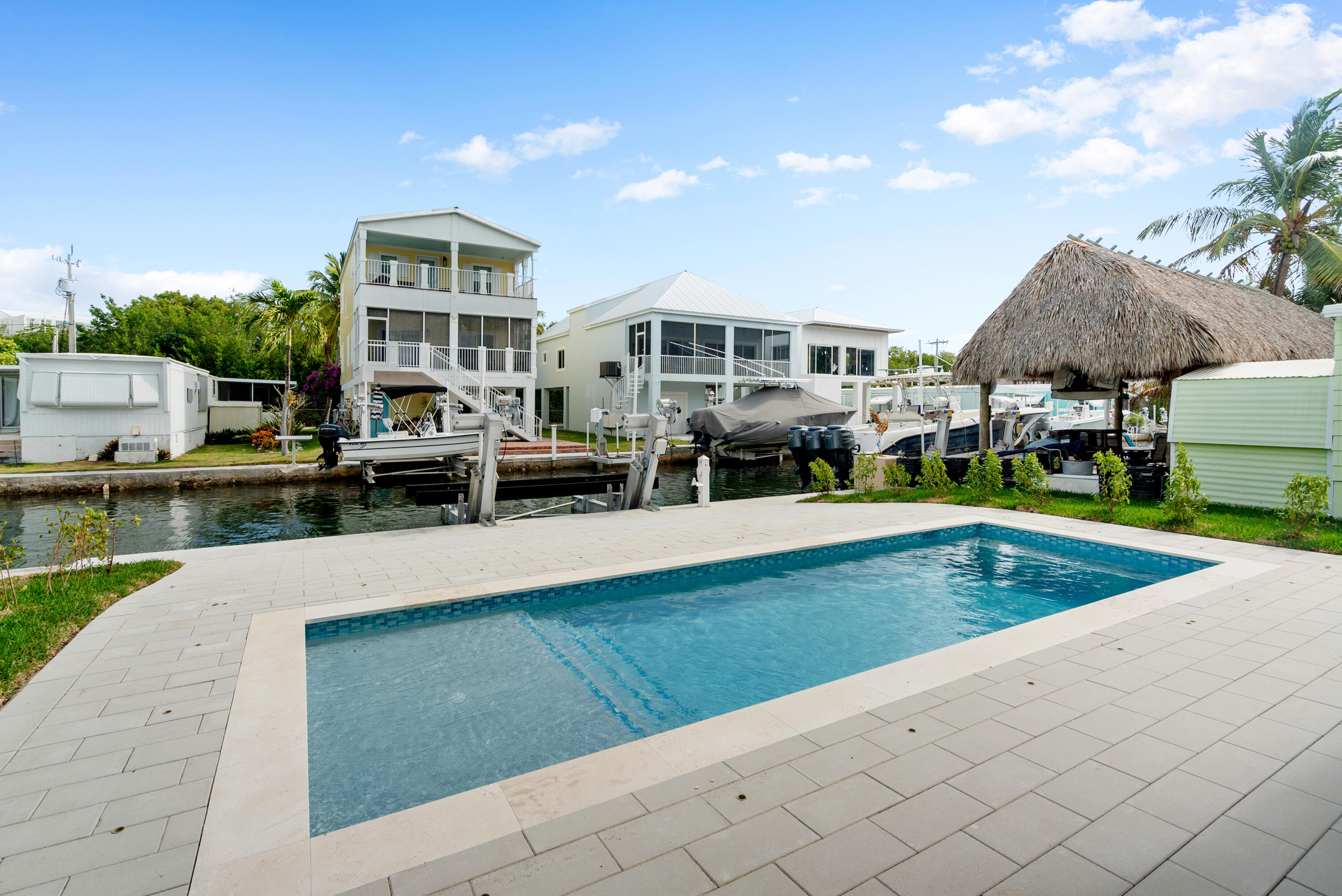 27 Ocean Drive Key Largo, FL 33037 - Photo 42 of 61 a view of a house with swimming pool and sitting area