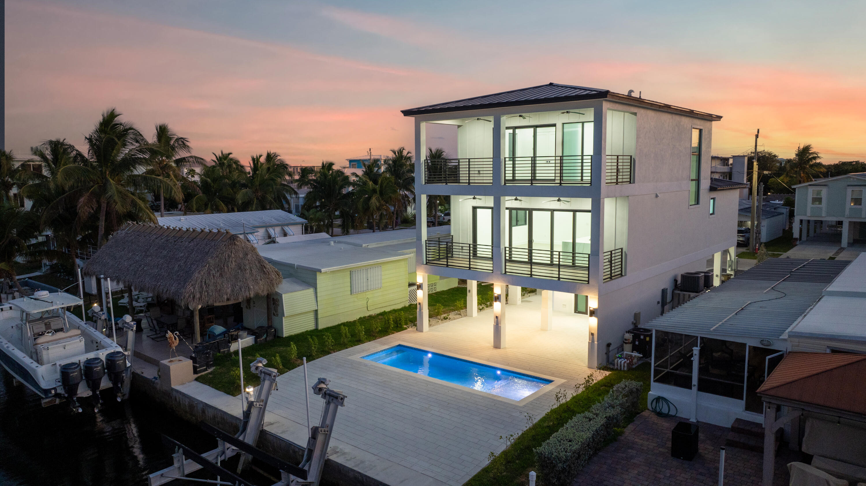 27 Ocean Drive Key Largo, FL 33037 - Photo 51 of 61 a front view of a house with a yard