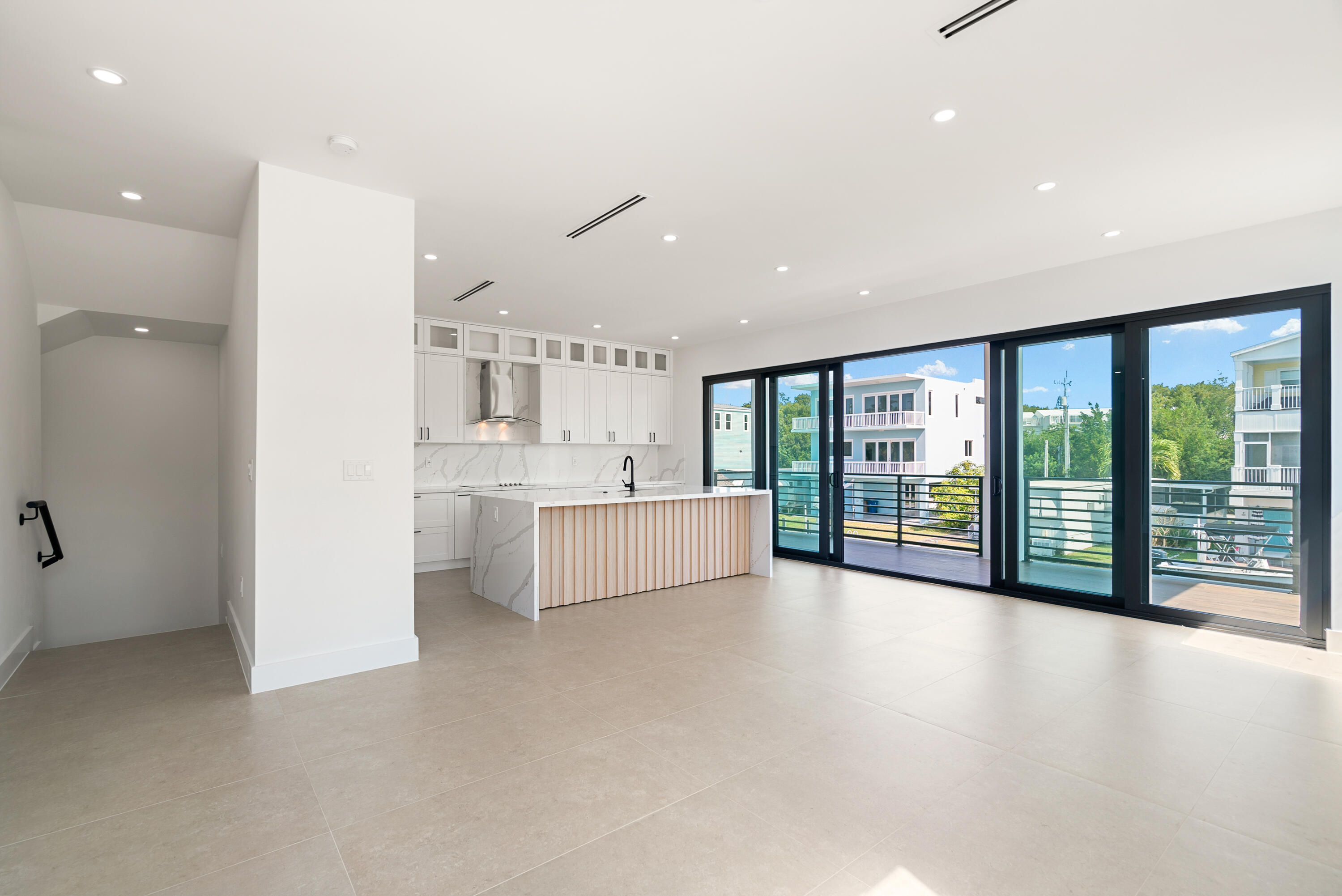 27 Ocean Drive Key Largo, FL 33037 - Photo 8 of 61 a large room with a large window and wooden floor