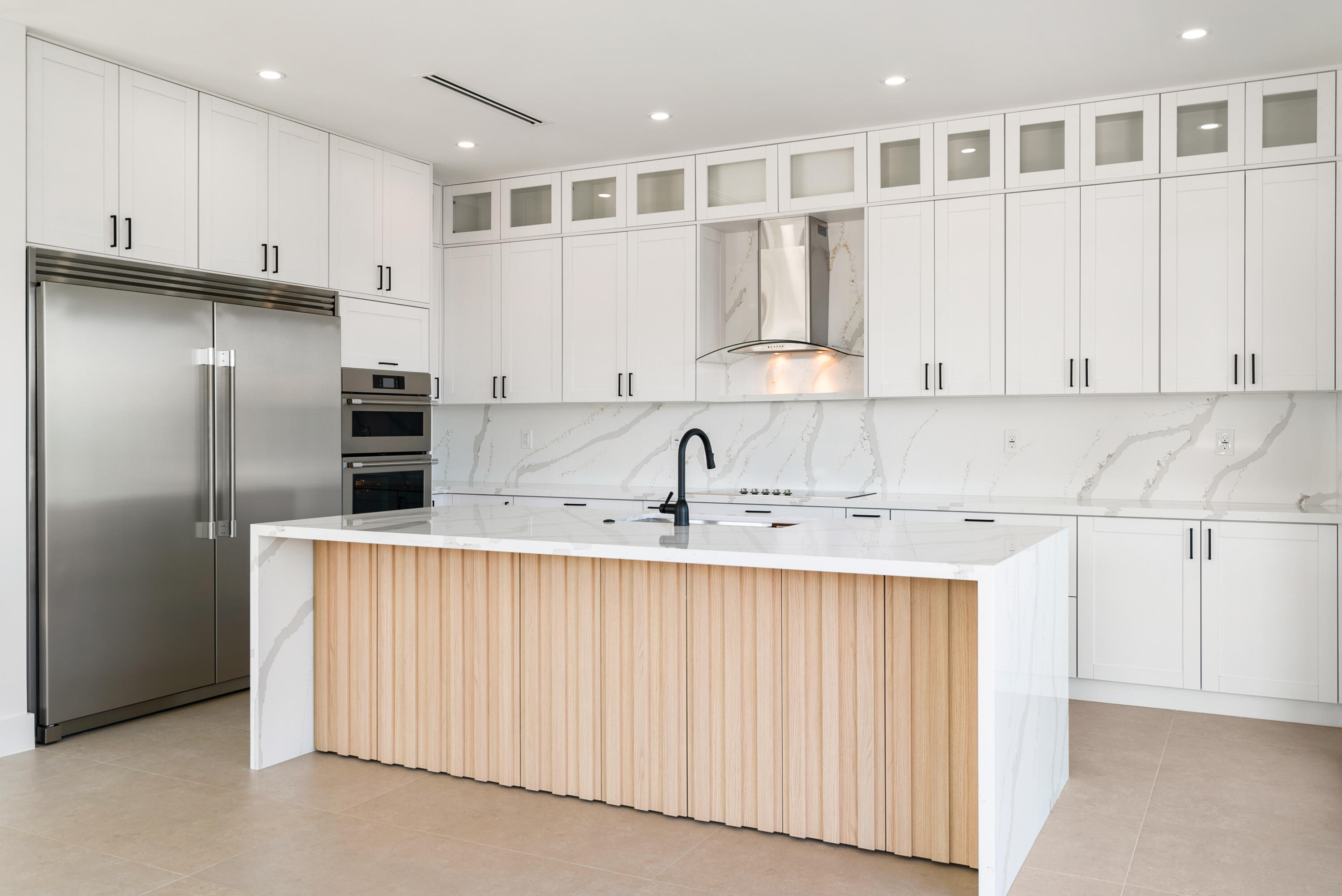 27 Ocean Drive Key Largo, FL 33037 - Photo 9 of 61 a kitchen with stainless steel appliances granite countertop a refrigerator sink and white cabinets