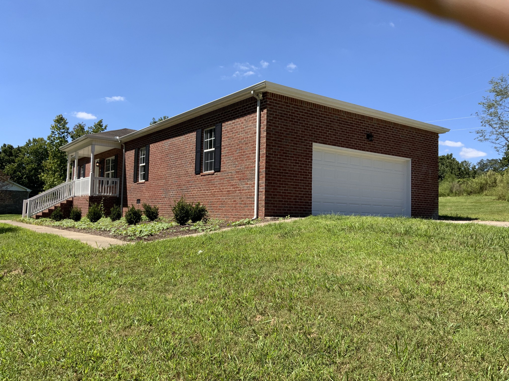 6190 Dewey Carr Road Bethpage, TN 37022 - Photo 1 of 37 a front view of house with yard and garage