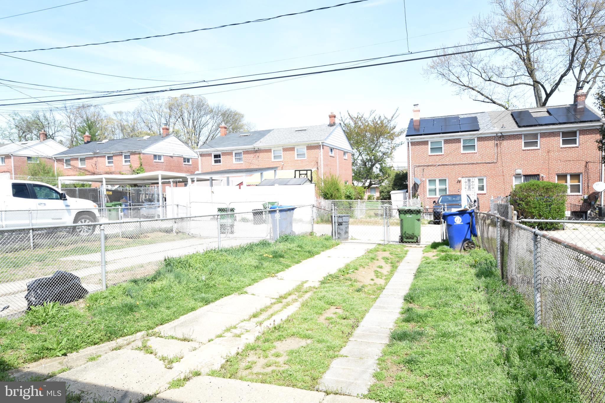 565 Brisbane Road Baltimore, MD 21229 - Photo 10 of 11 a front view of a house with a yard