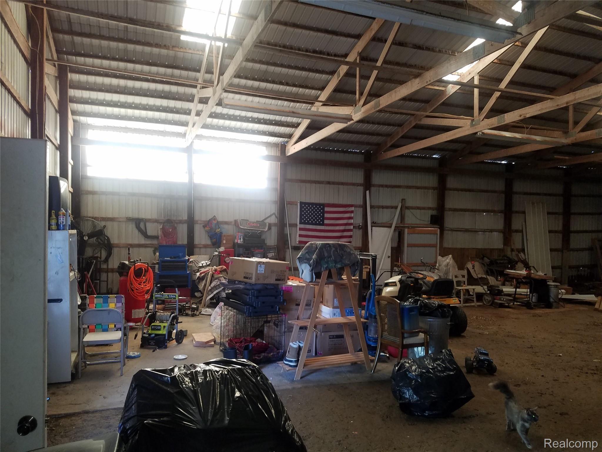 8147 Shipman Road Corunna, MI 48817 - Photo 23 of 26 inside pole barn 2.jpg
