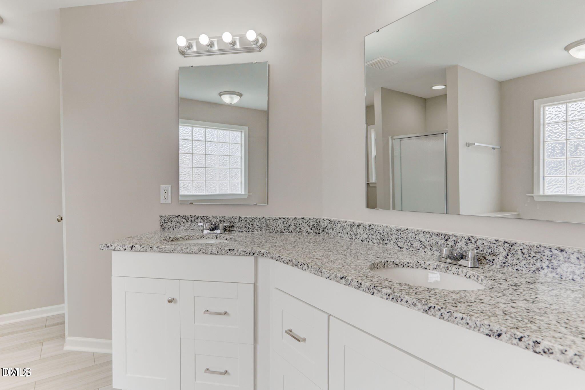 480 Seastone Street Raleigh, NC 27603 - Photo 19 of 26 a bathroom with a sink granite and a mirror