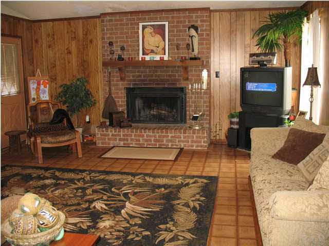 3043 Ranchette Square Gulf Breeze, FL 32563 - Photo 8 of 15 THIS LIVINGROOM IS VERY LARGE, HAS A VAULTED CEILING, SKYLIGHT, TILED FLOOR AND A BEAUTIFUL BRICK FIREPLACE.