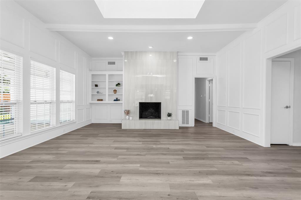 7233 Rustic Valley Drive Dallas, TX 75248 - Photo 2 of 21 a view of an empty room with a window and fireplace