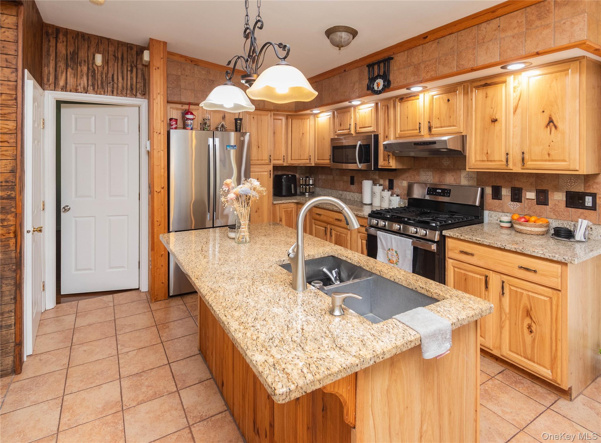29 Murray Road Middletown, NY 10940 - Photo 3 of 24 a kitchen with stainless steel appliances granite countertop a sink a stove counter space and cabinets